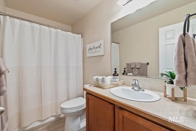 3499 S Green Basin Way, Nampa, ID 83686 - bathroom with vanity, a shower with curtain, and wood finished floors