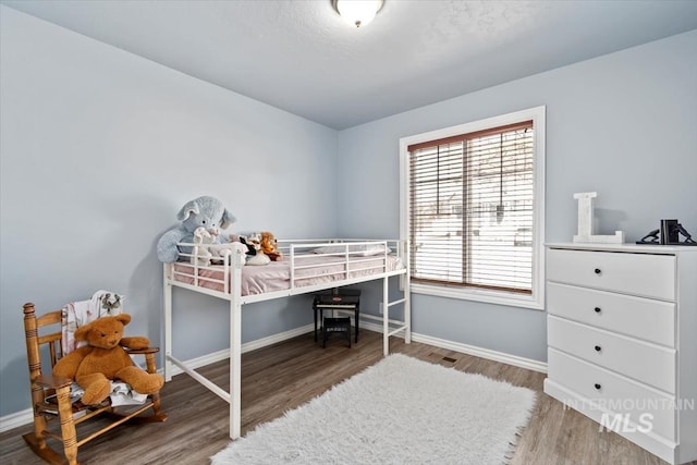 3499 S Green Basin Way, Nampa, ID 83686 - bedroom featuring wood finished floors and baseboards