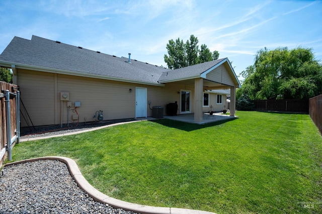 3499 S Green Basin Way, Nampa, ID 83686 - back of property featuring a patio, a fenced backyard, and a shingled roof