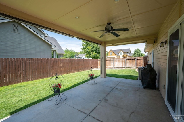 3499 S Green Basin Way, Nampa, ID 83686 - fenced backyard with a patio area, ceiling fan, and grilling area