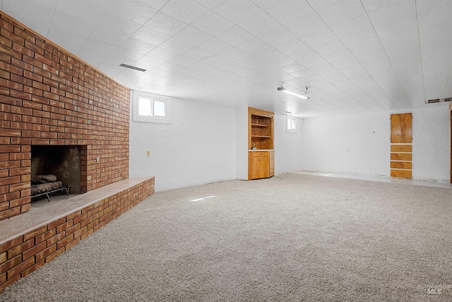 1520 R St, Heyburn, ID 83336 - unfurnished living room with a fireplace and carpet flooring