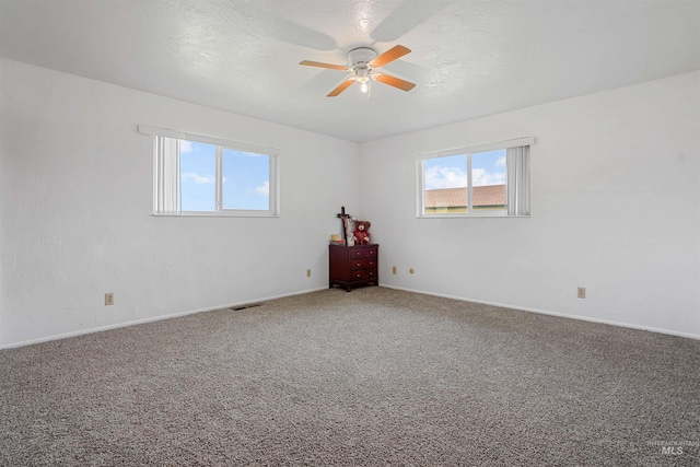 1520 R St, Heyburn, ID 83336 - spare room with ceiling fan, carpet flooring, and baseboards