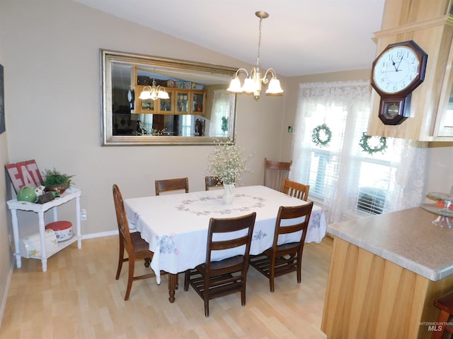 26737 Chips Ln, Parma, ID 83668 - dining area featuring a chandelier, light wood finished floors, and lofted ceiling