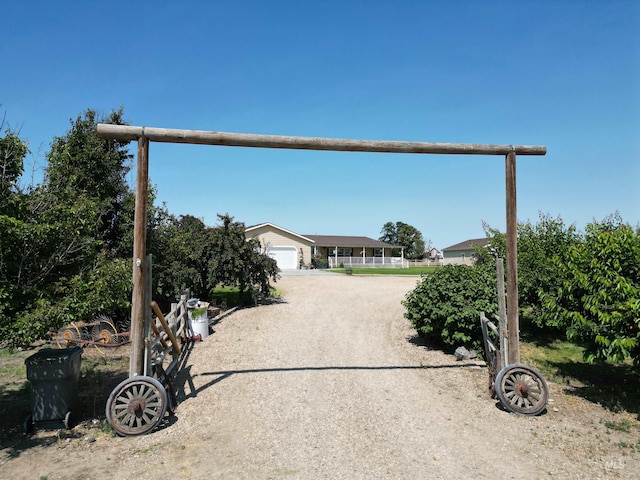 26737 Chips Ln, Parma, ID 83668 - view of front facade with dirt driveway and a garage