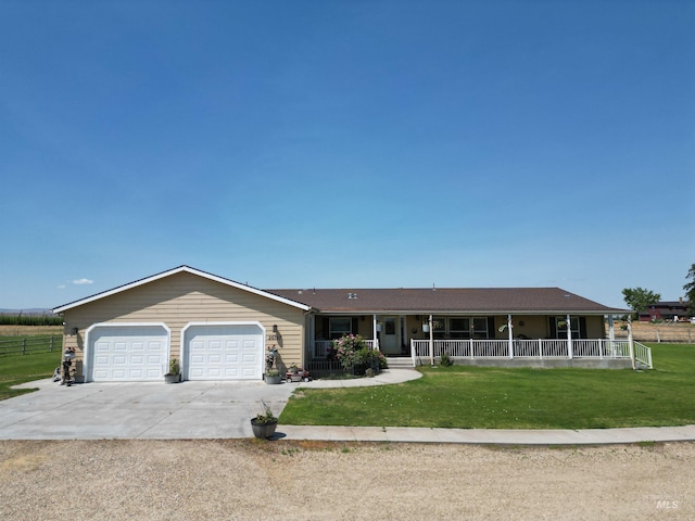 26737 Chips Ln, Parma, ID 83668 - view of front of property featuring covered porch, concrete driveway, and a garage