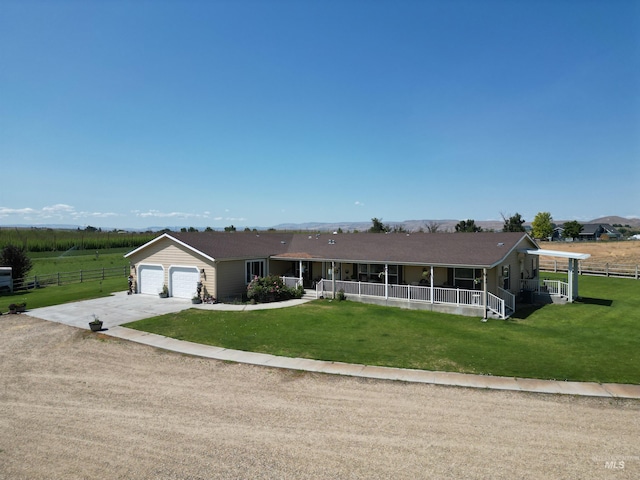 26737 Chips Ln, Parma, ID 83668 - view of front of home with driveway, a porch, and a garage