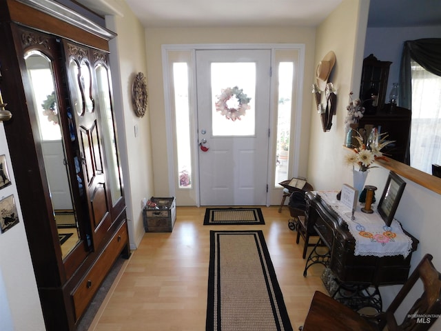26737 Chips Ln, Parma, ID 83668 - foyer entrance featuring plenty of natural light, light wood finished floors, and a baseboard heating unit