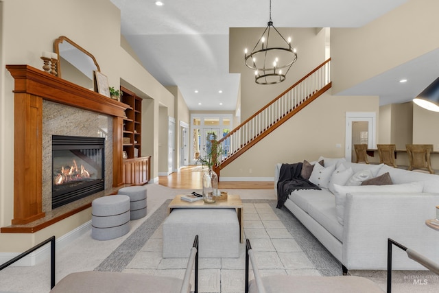 living room with a premium fireplace and light hardwood / wood-style flooring