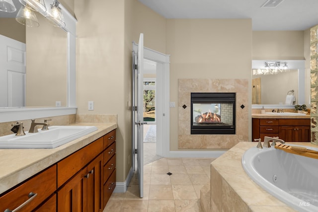 bathroom featuring vanity, a multi sided fireplace, tiled bath, and tile patterned flooring