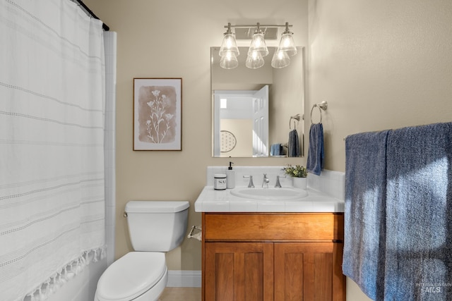 bathroom with toilet and vanity