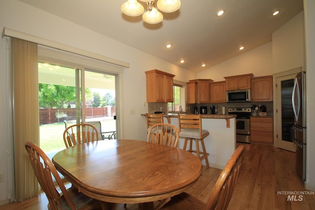 1491 N Millstream Ct, Nampa, ID 83686 - dining space featuring a chandelier, lofted ceiling, recessed lighting, and light wood-style floors