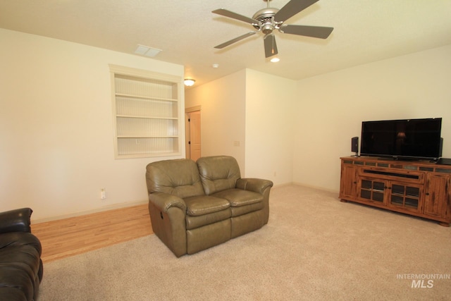 1491 N Millstream Ct, Nampa, ID 83686 - living room with carpet floors, a ceiling fan, built in features, and recessed lighting