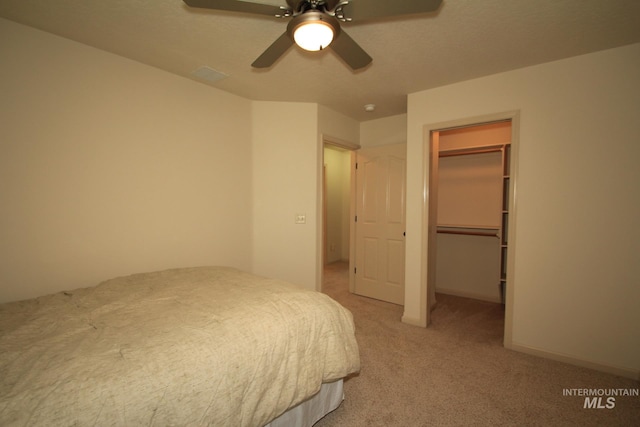 1491 N Millstream Ct, Nampa, ID 83686 - bedroom featuring light carpet, a spacious closet, ceiling fan, and a closet