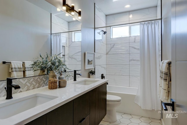 bathroom with toilet, shower / bath combination with curtain, double vanity, and a sink