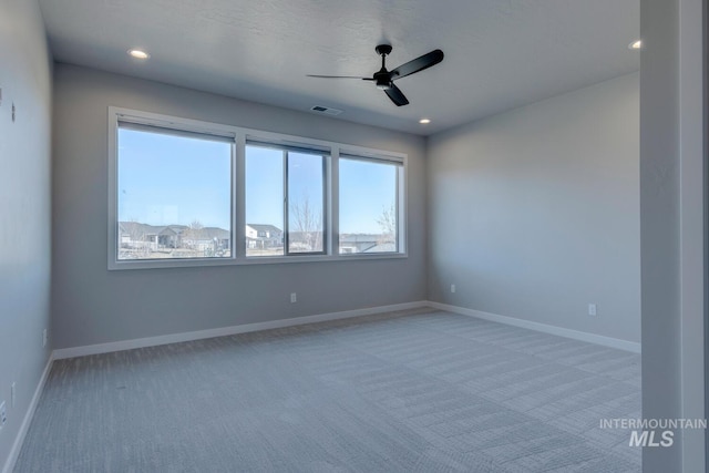 spare room featuring recessed lighting, visible vents, light carpet, ceiling fan, and baseboards