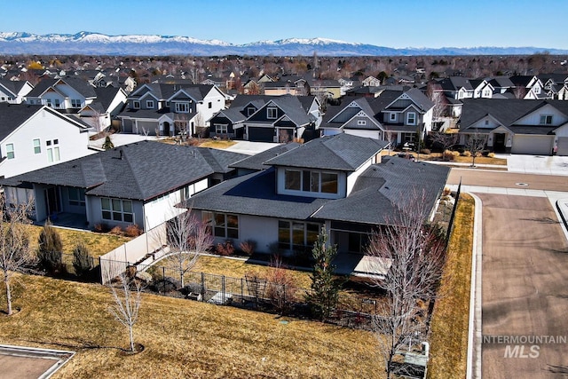 birds eye view of property with a residential view and a mountain view