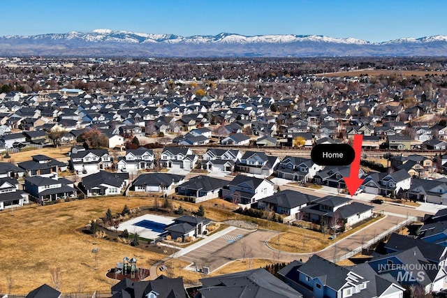 bird's eye view featuring a residential view and a mountain view