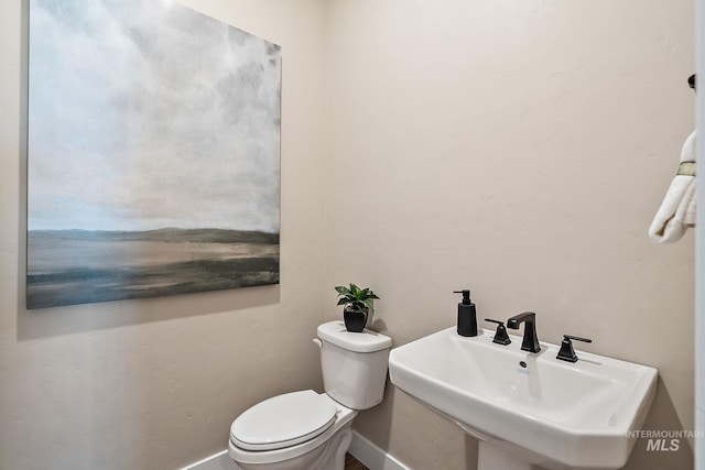 5420 W Double Blue St, Eagle, ID 83616 - half bathroom with a sink, baseboards, and toilet