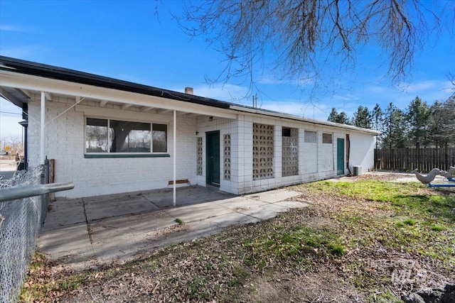 back of property with a patio area