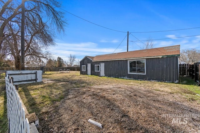 view of property exterior with a lawn