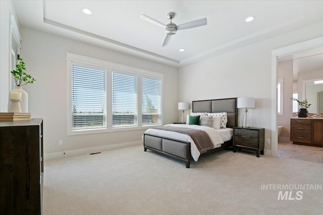 8469 W Happy Day Dr, Meridian, ID 83646 - carpeted bedroom featuring baseboards, recessed lighting, a raised ceiling, ensuite bath, and a ceiling fan