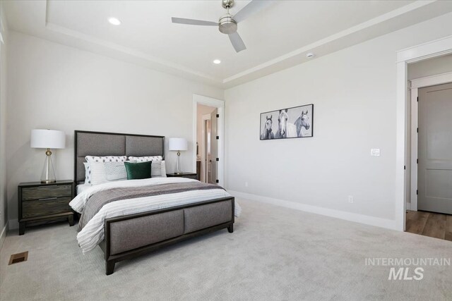 8469 W Happy Day Dr, Meridian, ID 83646 - carpeted bedroom featuring recessed lighting, baseboards, a tray ceiling, and ceiling fan