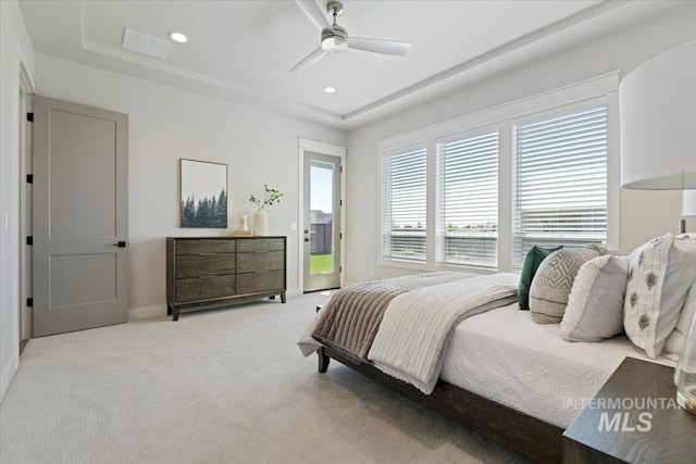 8469 W Happy Day Dr, Meridian, ID 83646 - bedroom with light colored carpet, a raised ceiling, ceiling fan, recessed lighting, and baseboards