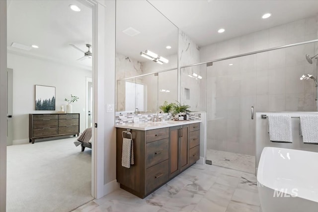 8469 W Happy Day Dr, Meridian, ID 83646 - bathroom featuring a stall shower, vanity, a freestanding tub, marble finish floors, and recessed lighting