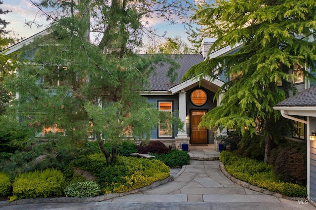 876 E Pennsylvania Ln, Boise, ID 83706 - view of front of house featuring a chimney and roof with shingles