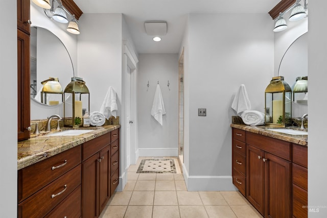 876 E Pennsylvania Ln, Boise, ID 83706 - full bathroom featuring two vanities, tile patterned flooring, a stall shower, baseboards, and recessed lighting