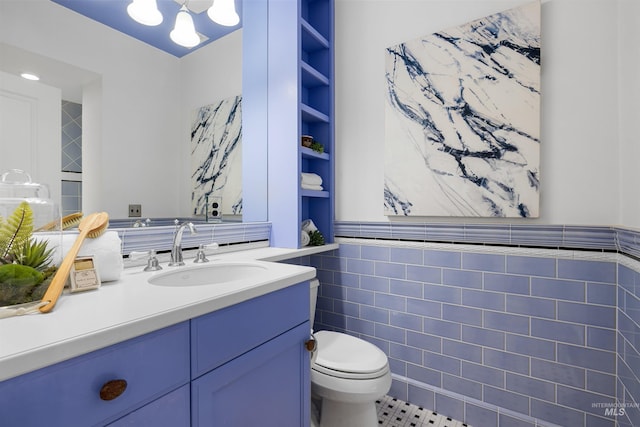 876 E Pennsylvania Ln, Boise, ID 83706 - bathroom featuring tile walls, toilet, and vanity