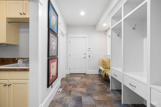 876 E Pennsylvania Ln, Boise, ID 83706 - mudroom featuring baseboards, stone finish flooring, a sink, and recessed lighting