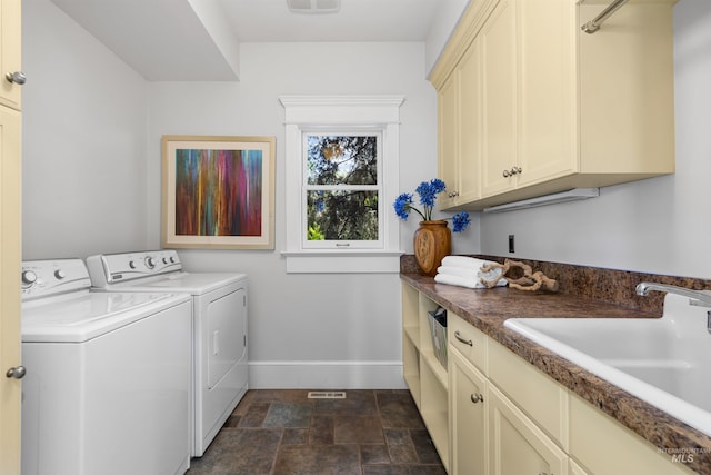 876 E Pennsylvania Ln, Boise, ID 83706 - laundry area with washing machine and clothes dryer, baseboards, stone finish flooring, and cabinet space