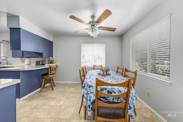 1395 W 3rd St, Weiser, ID 83672 - dining area with a ceiling fan and light tile patterned floors