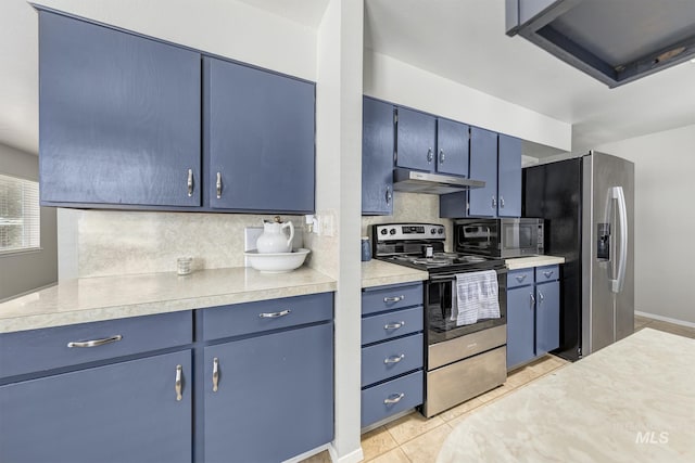 1395 W 3rd St, Weiser, ID 83672 - kitchen with stainless steel appliances, blue cabinetry, and tasteful backsplash