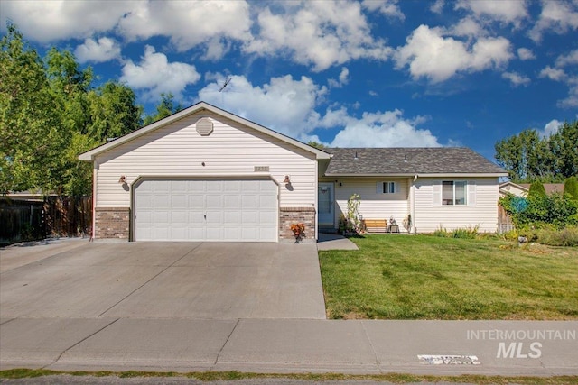 ranch-style home featuring a garage and a front lawn