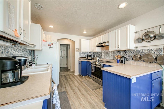 kitchen featuring white cabinets, stainless steel electric range, light wood-type flooring, and blue cabinetry