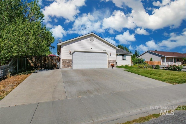 single story home with a garage and a front lawn