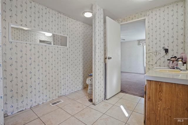 bathroom featuring vanity, toilet, and tile patterned floors