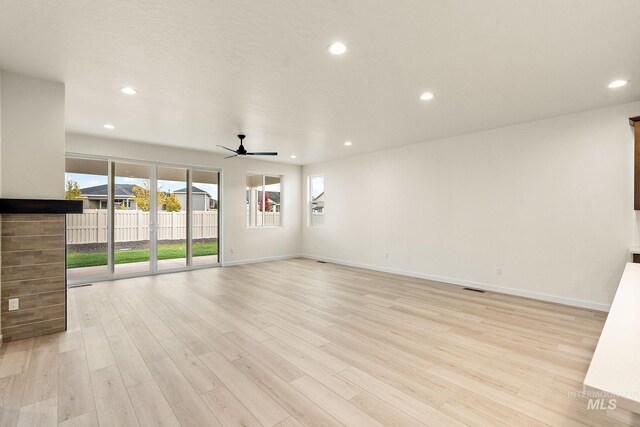 unfurnished room featuring baseboards, recessed lighting, light wood-type flooring, and a ceiling fan
