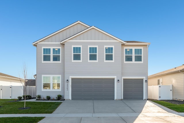 view of front of house with a garage, fence, a front lawn, and a gate