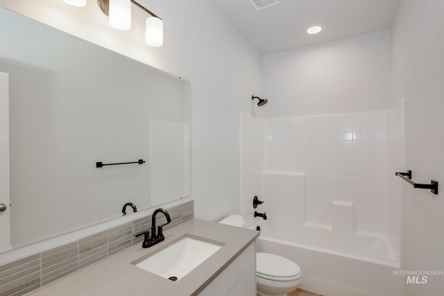 full bathroom featuring shower / bathtub combination, toilet, and vanity