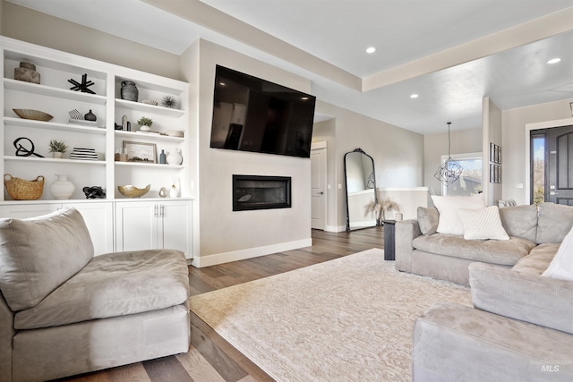 129 E 33 S, Burley, ID 83318 - living area with baseboards, recessed lighting, dark wood-type flooring, and a glass covered fireplace