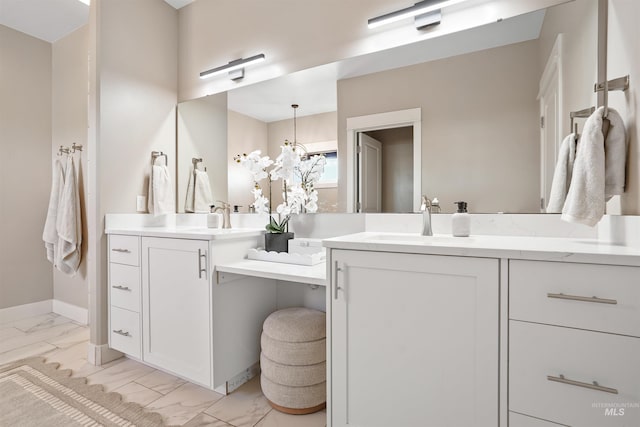 129 E 33 S, Burley, ID 83318 - bathroom featuring marble finish floor, vanity, and baseboards