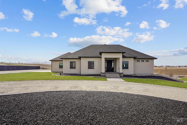 129 E 33 S, Burley, ID 83318 - view of front of property with stucco siding, a shingled roof, and a front lawn