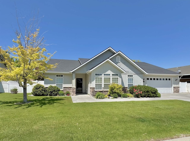 2577 Longbow Dr, Twin Falls, ID 83301 - craftsman-style home with stone siding, concrete driveway, a garage, and board and batten siding