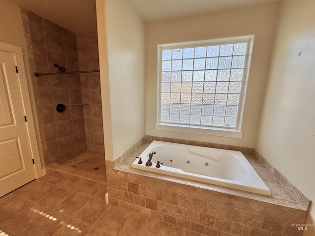 2577 Longbow Dr, Twin Falls, ID 83301 - full bathroom featuring a tub with jets, tiled shower, and tile patterned floors