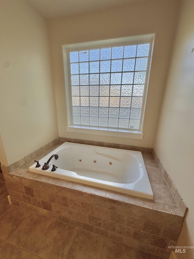 2577 Longbow Dr, Twin Falls, ID 83301 - full bathroom featuring a whirlpool tub and tile patterned flooring