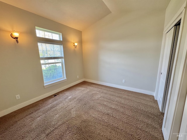 2577 Longbow Dr, Twin Falls, ID 83301 - carpeted empty room with vaulted ceiling and baseboards