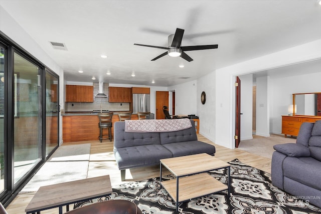 living room featuring visible vents, recessed lighting, light wood-type flooring, and ceiling fan